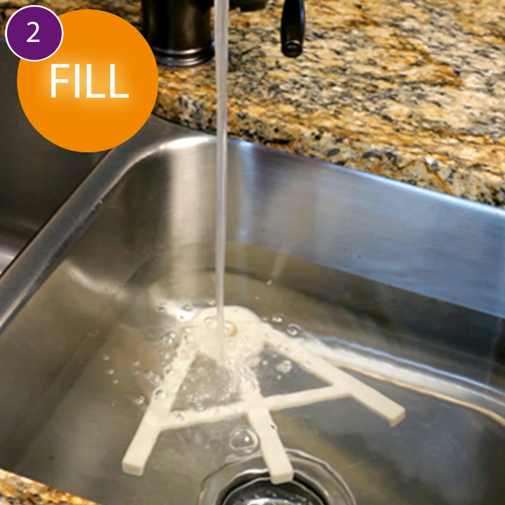 Thaw Claw attached to a sink as it fills with water
