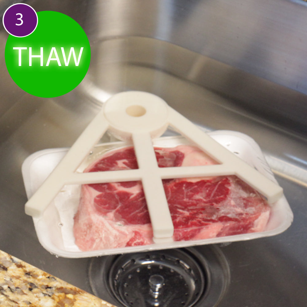 Step 3: THAW - Thaw Claw holding a food package beneath its arms in a sink